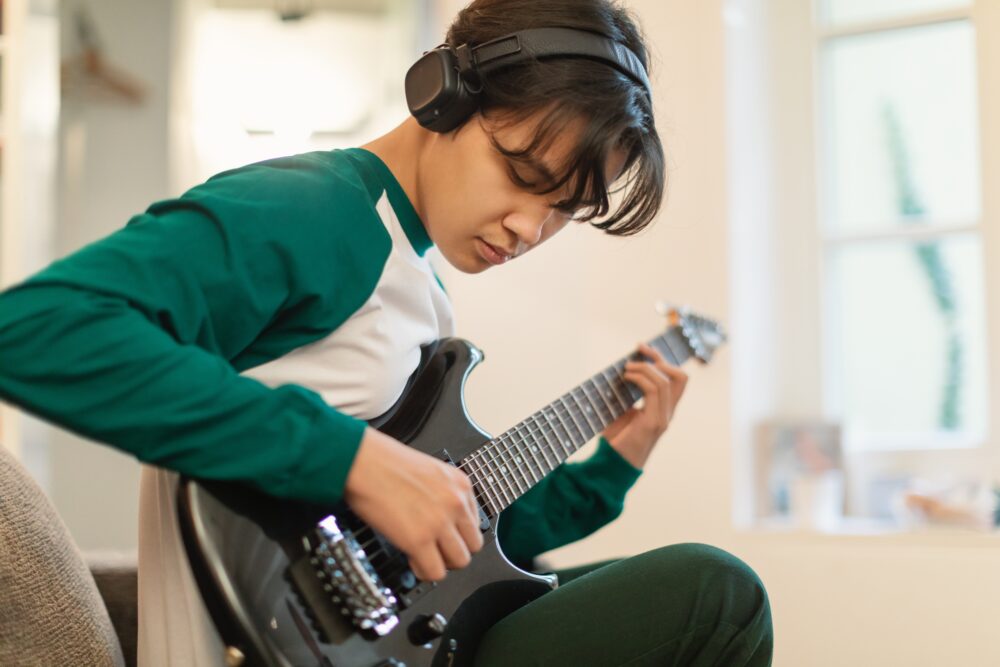 Kid playing guitar