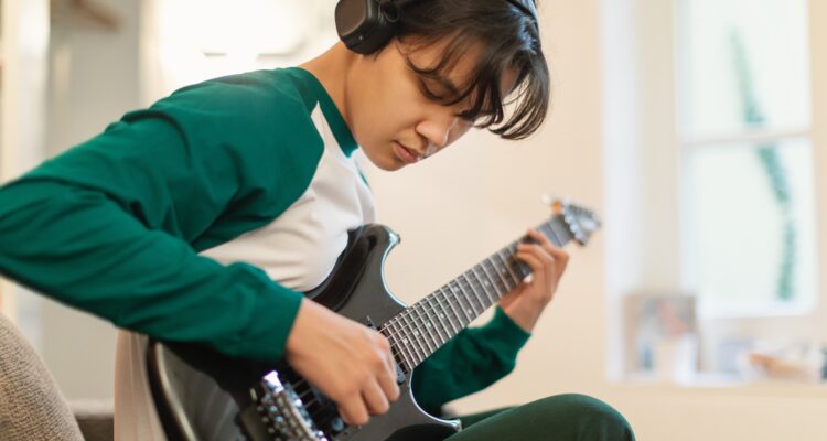 Kid playing guitar