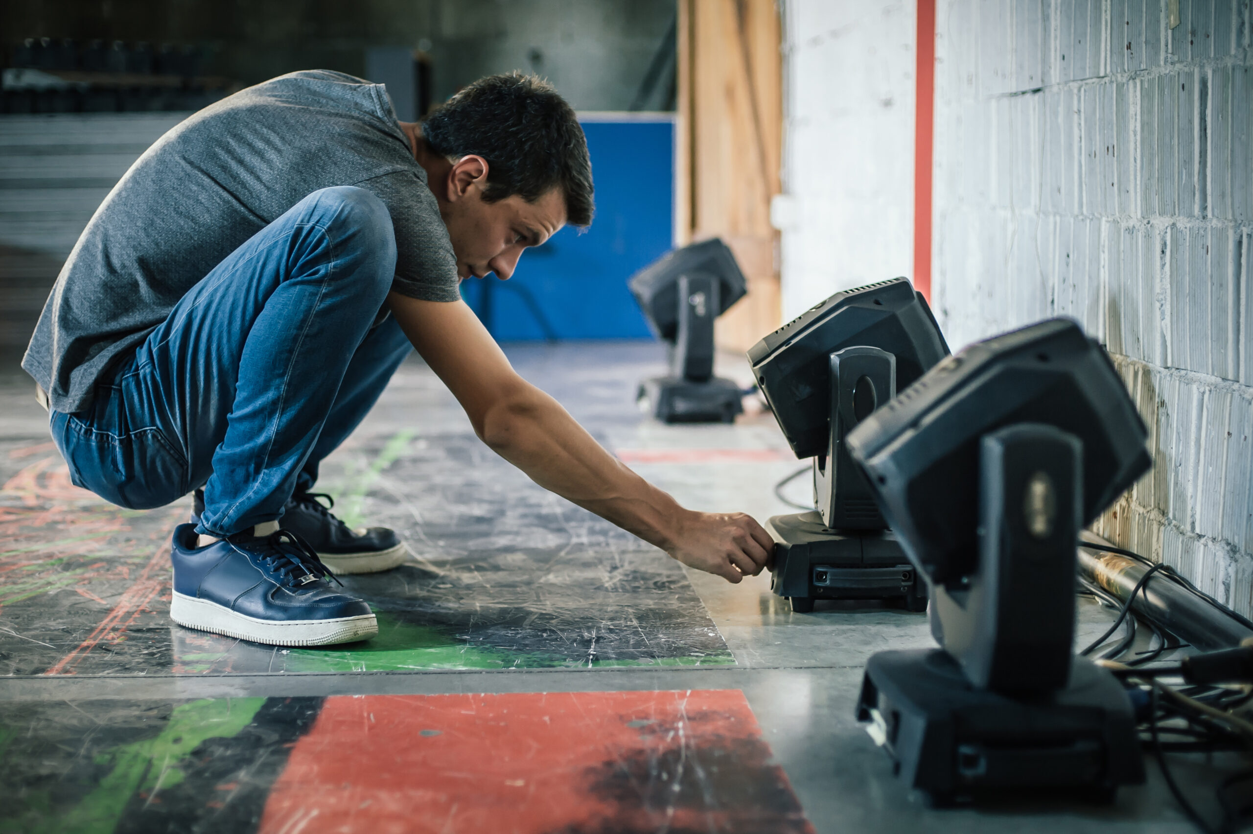 Person adjusting theatre lighting