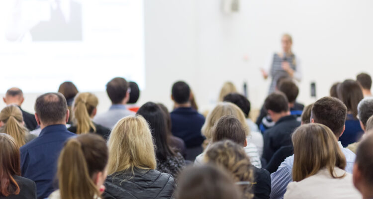 Group of staff members watching a presentation