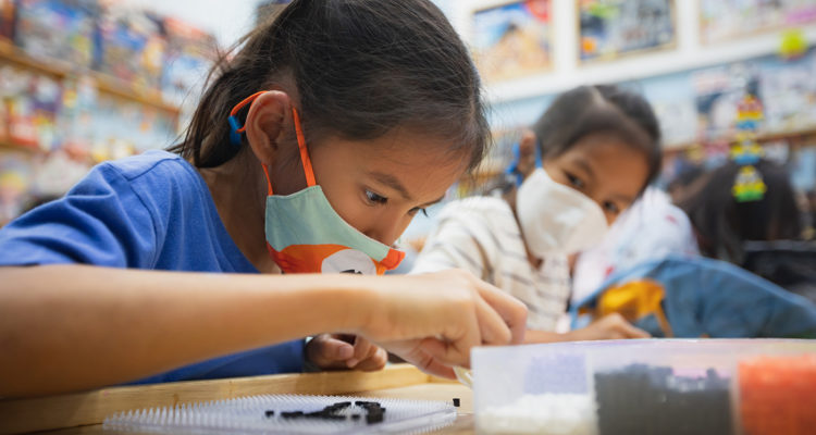 student wearing a mask in a classroom