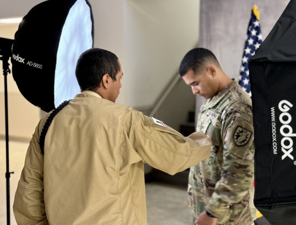 Ortega fixing a cadre member's uniform.