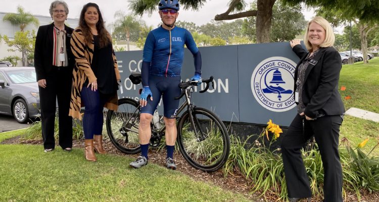 Brian Dozer with bike and OCDE staff