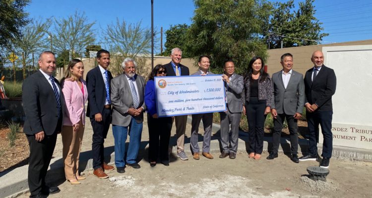 Local dignitaries with over-sized check
