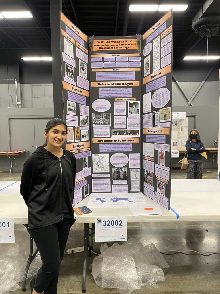 Northwood High School student Riya Gupta poses with her winning project at the NHD-CA finals.