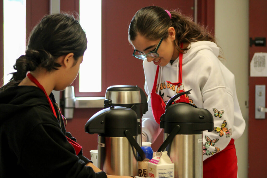 Ocean View High School students prepare coffee orders for teachers on campus. 