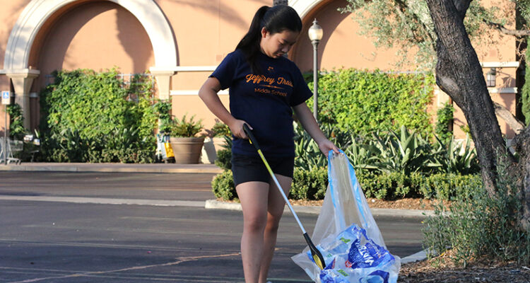 Irvine middle school student Claire Chong picks up trash on her morning walk before school.