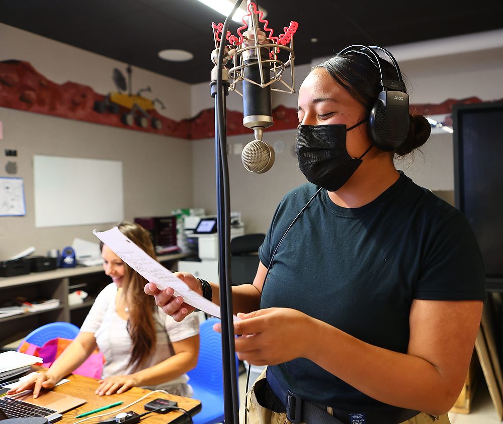 Sunburst Academy Class 30 cadet Abigail Ramirez practice rap lyrics with musician Jamie Ross.  