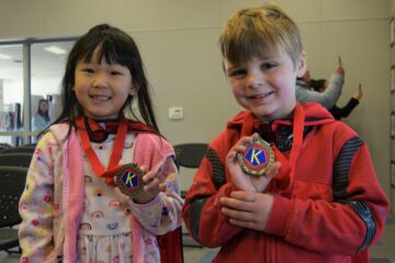 Corey Elementary School kindergartners hold their medals for participating in Kinder Kindness Week at Buena Park School District.