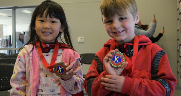 Corey Elementary School kindergartners hold their medals for participating in Kinder Kindness Week at Buena Park School District.