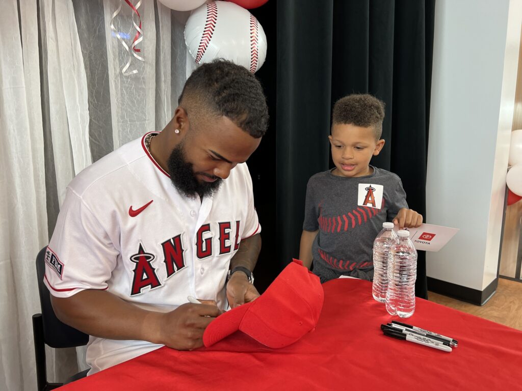 Angels Luis Rengifo signs hat for student.