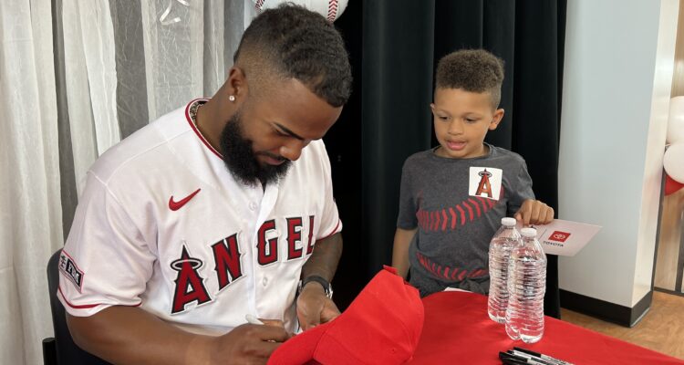 Angels Luis Rengifo signs hat for student.