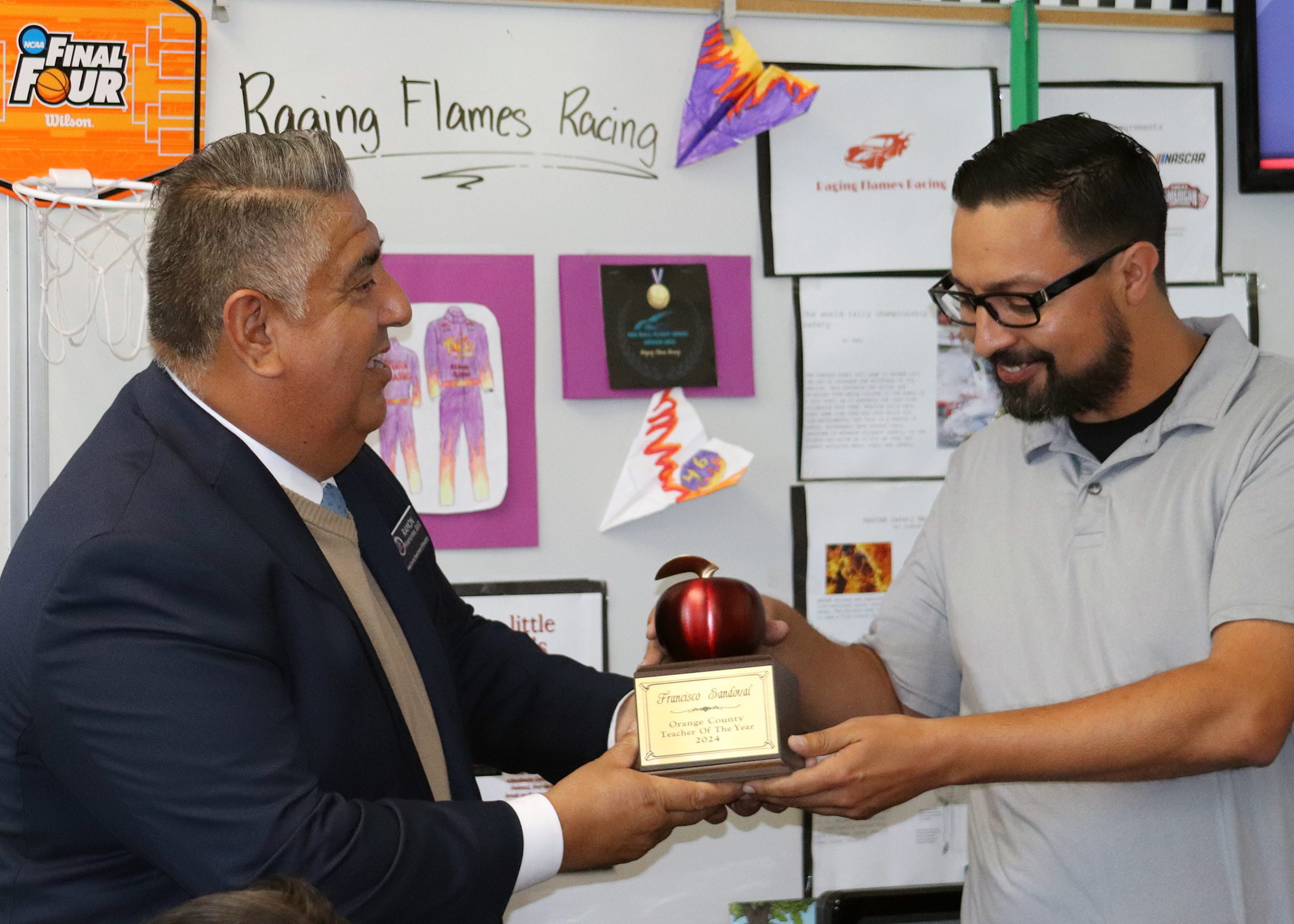 Orangethorpe Elementary School teacher Francisco Sandoval accepts his Teacher of the Year award.