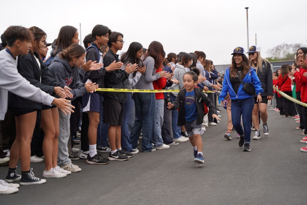Garden Grove students with disabilities are greeted with high-fives at the 52nd Special Games event.