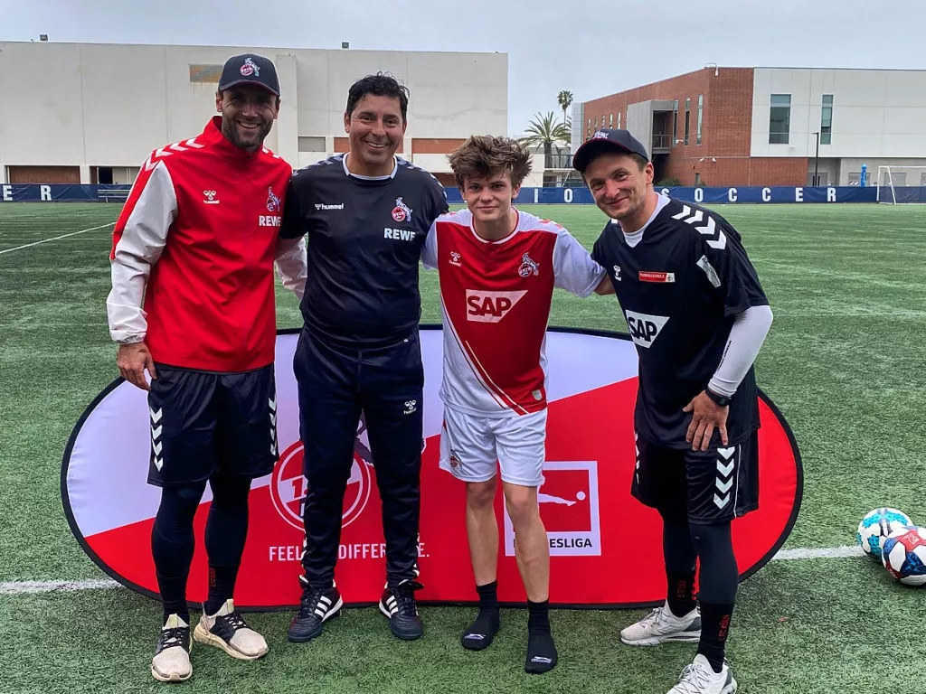 Alex Linza, third from left, is pictured with FC Cologne recruiter Herbert Biste, coach Jorge Caceres and coach Herbert Zimmerman. (Courtesy of the Linza family)