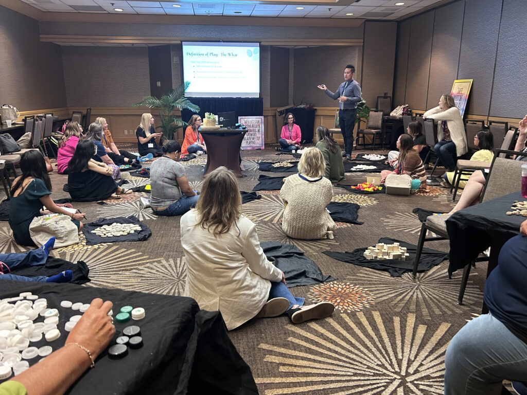 Education professionals attend a session about the benefits of play on child development at the Early Learning Summer Institute.