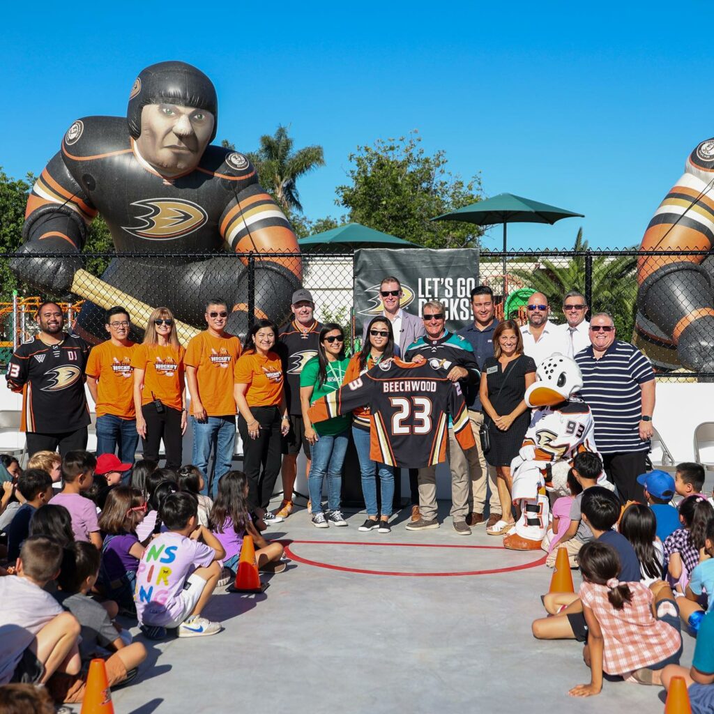 Fullerton School District officials join the Anaheim Ducks Foundation representatives to unveil the new hockey rink at Beechwood School. (Courtesy of the Anaheim Ducks)