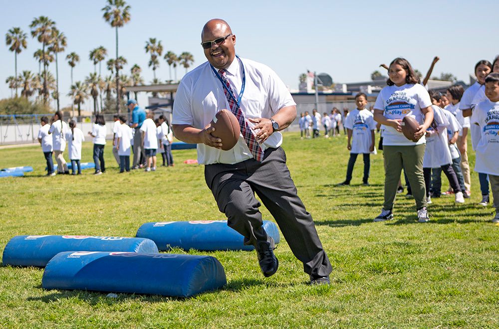 Dr. Christopher Downing takes part in a school activity.