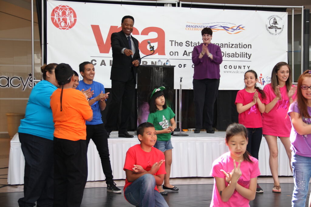 Master of Ceremonies William Allen Young and American Sign Language Interpreter Paula Dunn reacts to a group of students who performed at the 2017 VSA Orange County Festival. 