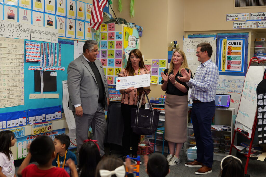 Arbolita Elementary School teacher Kathryn Mayfield receives a $25,000 award from the Orange County Teachers of the Year Award Foundation, established by the William, Jeff and Jennifer Gross Family Foundation.