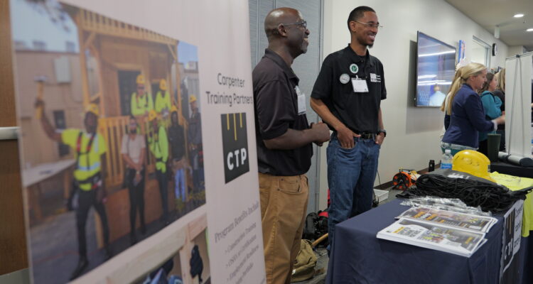 Representatives from Carpenter Training Partners connect with students and educators at the OC Pathways Showcase on Dec. 7, 2023.