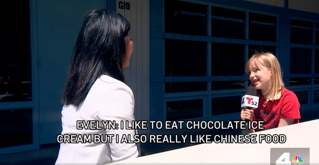 Fourth-grader and language immersion program student Evelyn Barron practices speaking Mandarin Chinese with reporter Hetty Chang. (Courtesy of NBC 4 Los Angeles)