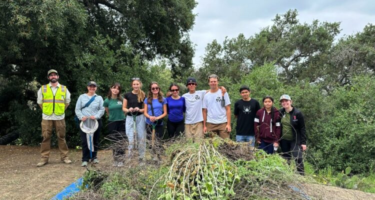Teacher Danica Perez (far right) and her students, accompanied by local biologists, lead a successful cleanup effort at Coyote Hills Tree Park in May, focusing on removing invasive plants to restore the park's natural ecosystem.