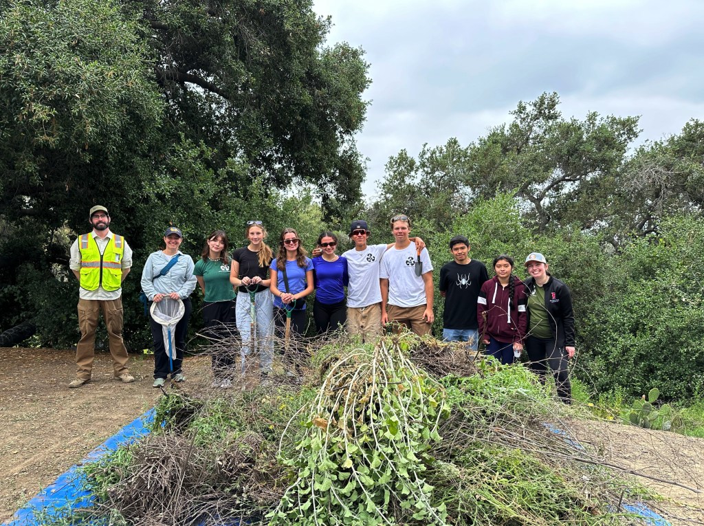 Teacher Danica Perez (far right) and her students, accompanied by local biologists, lead a successful cleanup effort at Coyote Hills Tree Park in May, focusing on removing invasive plants to restore the park's natural ecosystem. 