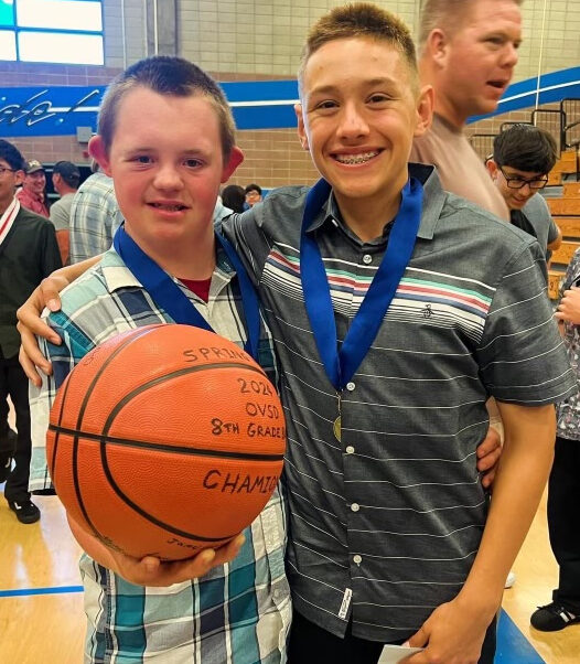 Spring View Middle School student Dean Northam presented the team ball to student Brandon Parsons at the year-end awards assembly on June 10. (Courtesy of Ocean View School District)  