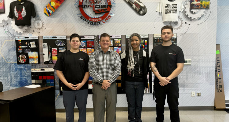 CTE teacher Michael Poirier poses with Spyder Lab student mentors Davian, Light and Alex at OCDE’s Harbor Learning Center South Campus in Fountain Valley.