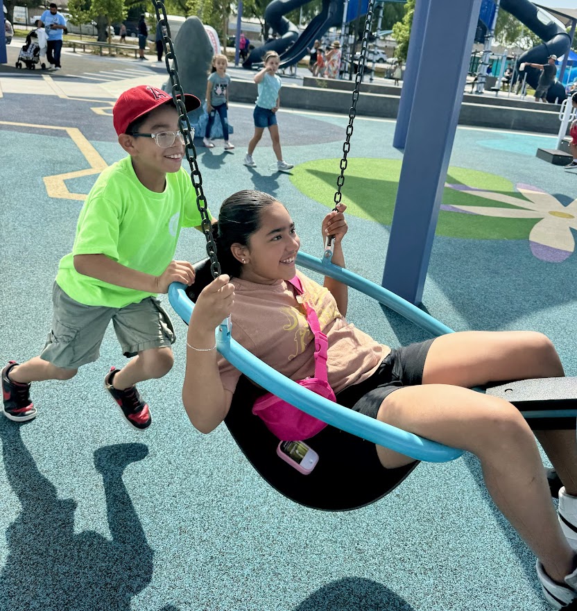 Whitaker Elementary School students play on the swing set at Whitaker Park Aug. 7. 