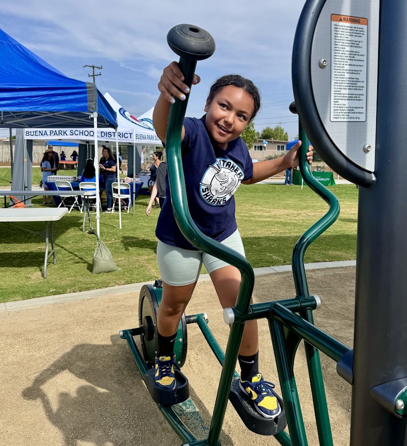 A Whitaker Elementary School student tries out the new fitness circuit at Whitaker Park on Aug. 7. 