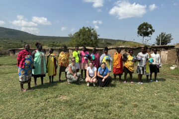 Fullerton Union High School teacher Alexandra Walker and her family with Maasai Mara school-aged children in Kenya, where they donated 400 menstrual pads to support education and address period poverty. (Courtesy of Alexandra Walker)