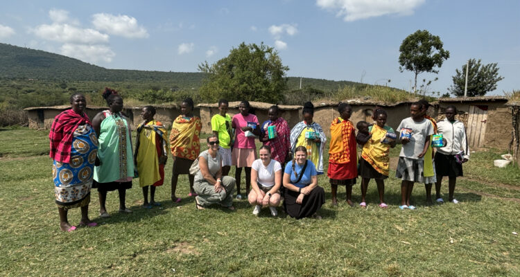 Fullerton Union High School teacher Alexandra Walker and her family with Maasai Mara school-aged children in Kenya, where they donated 400 menstrual pads to support education and address period poverty. (Courtesy of Alexandra Walker)