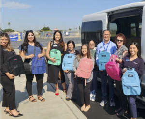 OCDE McKinney-Vento District Liaisons and SchoolsFirst FCU members distribute backpacks filled with school supplies to campuses on July 24.