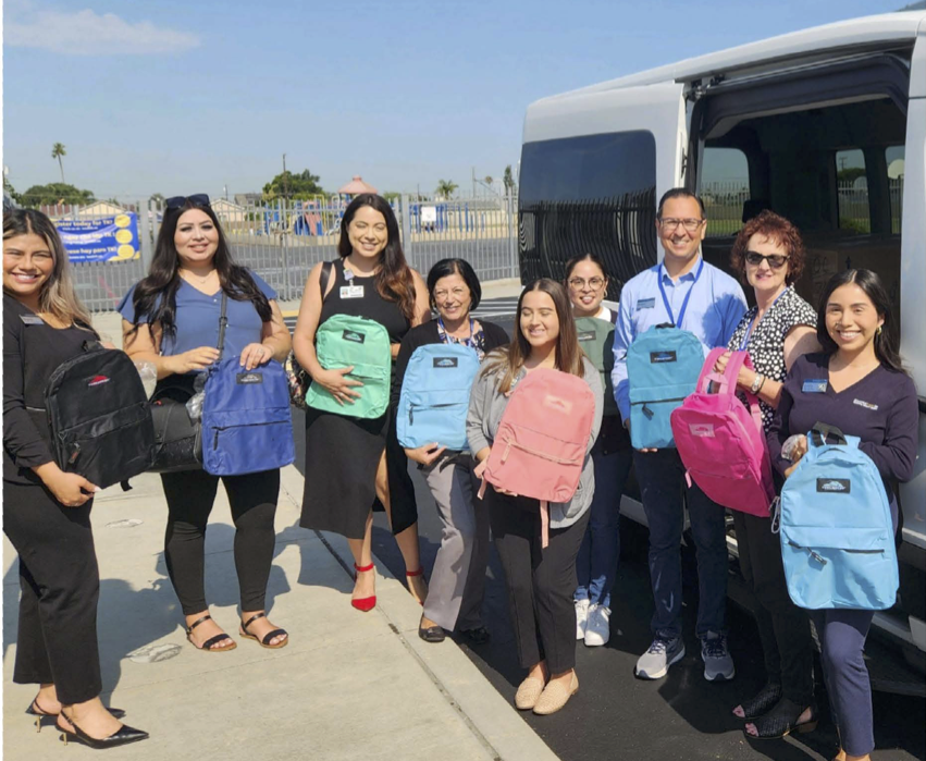 OCDE McKinney-Vento District Liaisons and SchoolsFirst FCU partners distribute backpacks filled with school supplies to campuses on July 24.