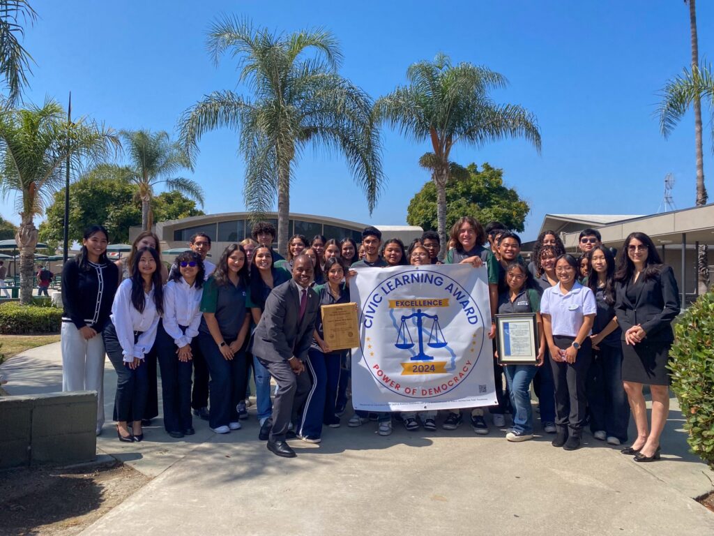 State Superintendent Tony Thurmond, California Chief Justice Patricia Guerrero, Anaheim Union High School District Superintendent Michael Matsuda, school administrators and students gather after receiving the 2024 Civic Learning Award of Excellence at the La Palma campus on Sept. 23. 