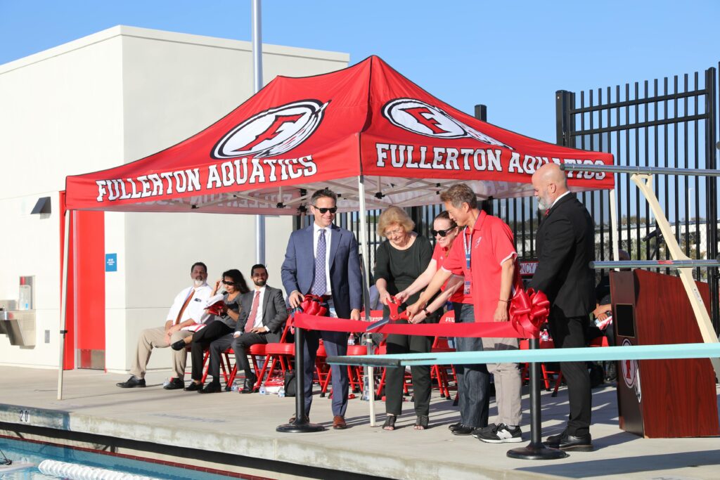 Officials cutting ceremonial ribbon