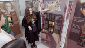 Los Alamitos High School student Maleah Fennessy guides students through the Anne Frank - A History for Today exhibit at Los Alamitos High School on Oct. 16.