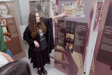 Los Alamitos High School student Maleah Fennessy guides students through the Anne Frank - A History for Today exhibit at Los Alamitos High School on Oct. 16.