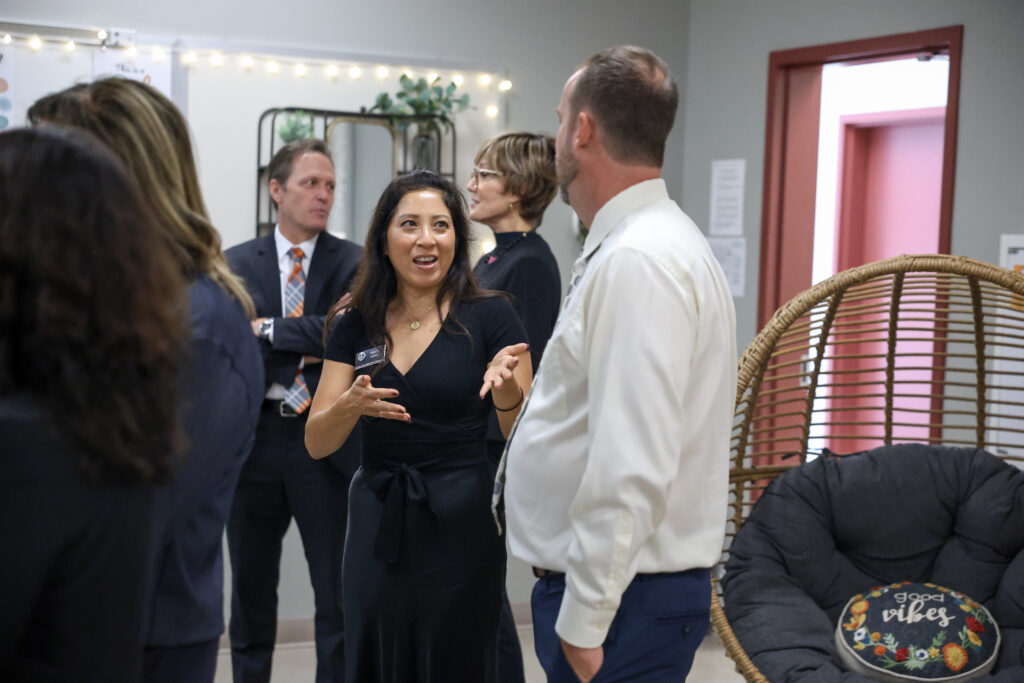 Mayu Iwatani, OCDE Administrator of Mental Health and Wellness, speaks with Ocean View High School Principal Dr. Robert Rasmussen inside "The Well Nest."