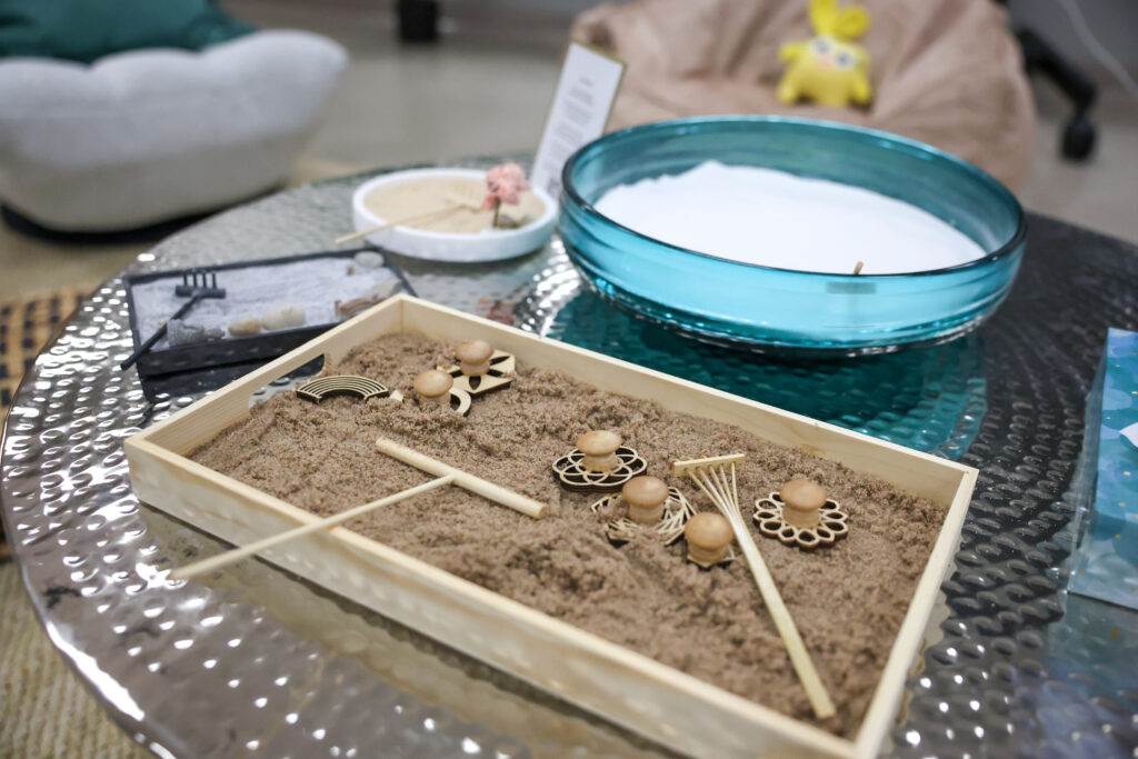 A miniature Japanese zen garden kit provides students with a calming activity during a busy school day.