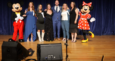 The six Orange County Teacher of the Year finalists are congratulated by Mickey and Minnie at the Disneyland Hotel.