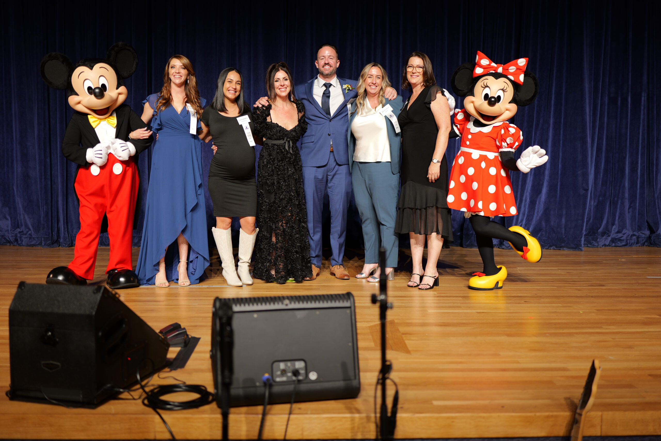 The six Orange County Teacher of the Year finalists are congratulated by Mickey and Minnie at the Disneyland Hotel.