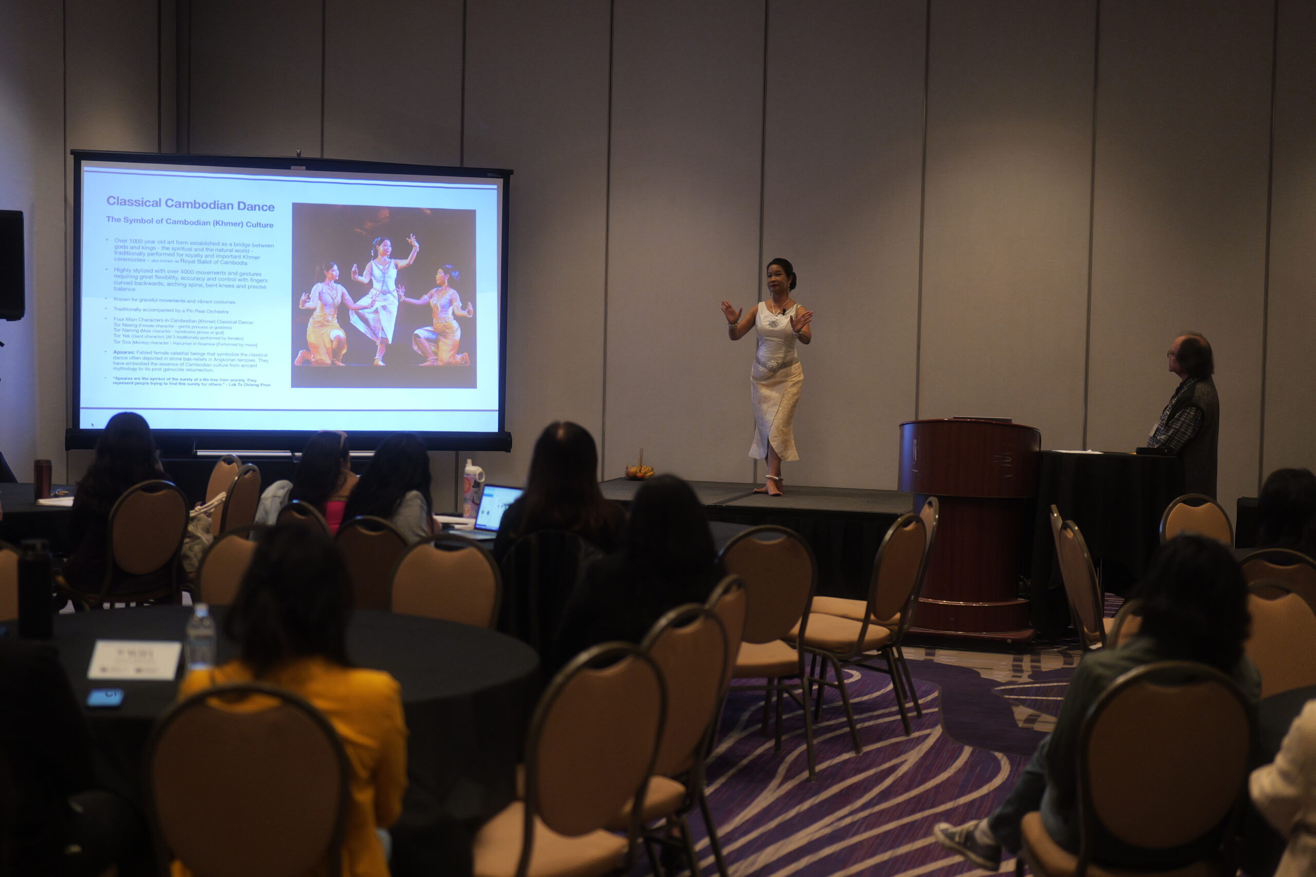 Conference attendees observe a cultural presentation highlighting traditional Cambodian music and dance, celebrating the rich heritage of the Cambodian American community.