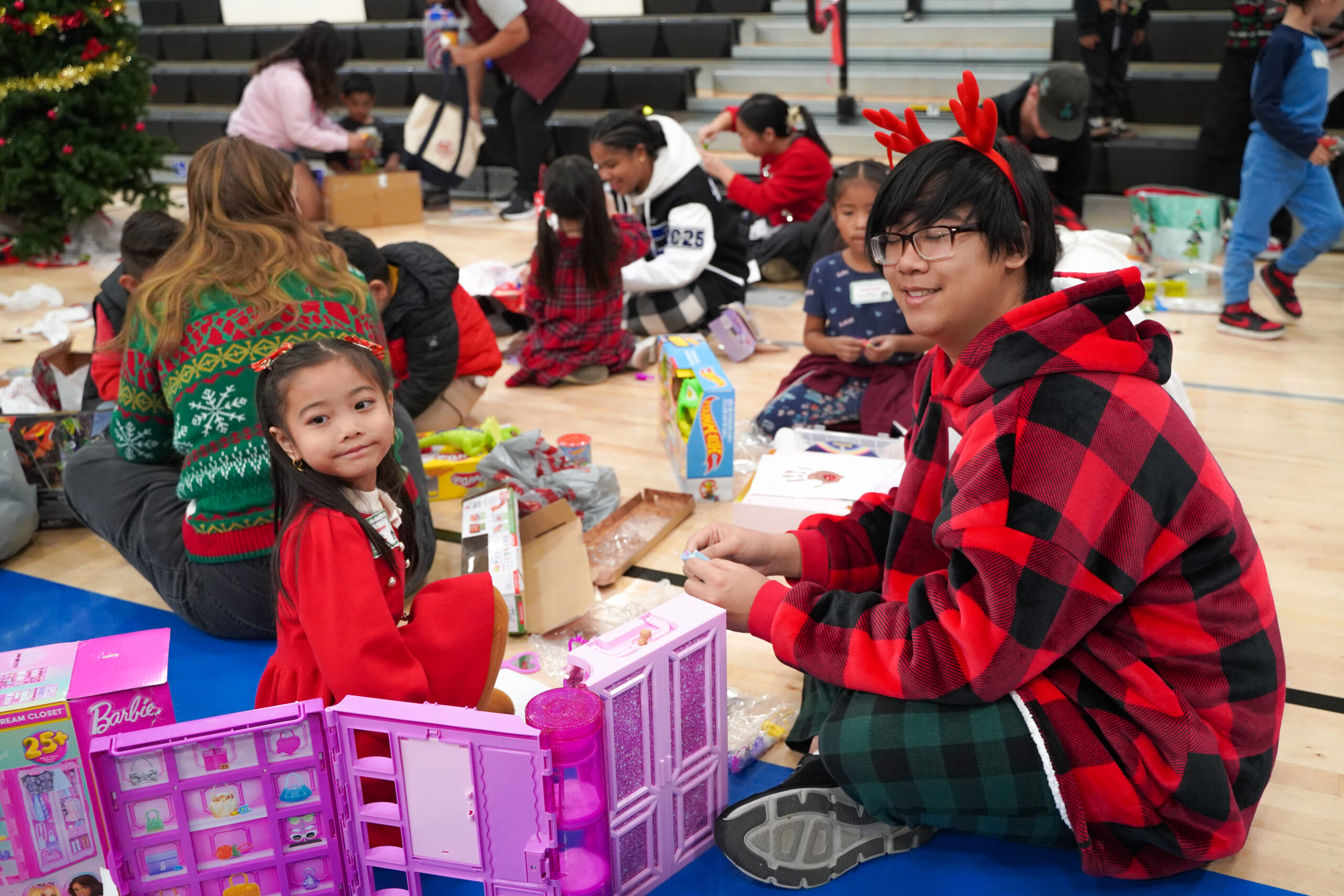 A kindergarten student with a high school senior