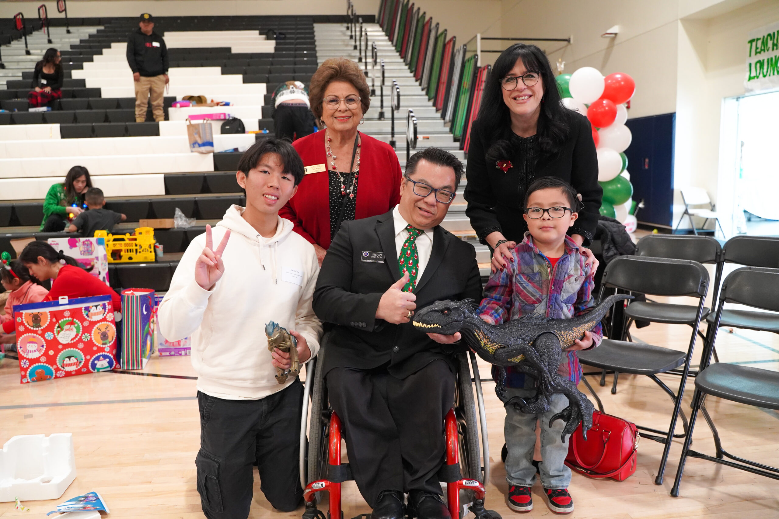 Orange County Superintendent Dr. Stefan Bean flanked by GGUSD Board of Education President Teri Rocco, Garden Grove Superintendent Dr. Gabriela Mafi, a high school senior, and a kindergarten student.