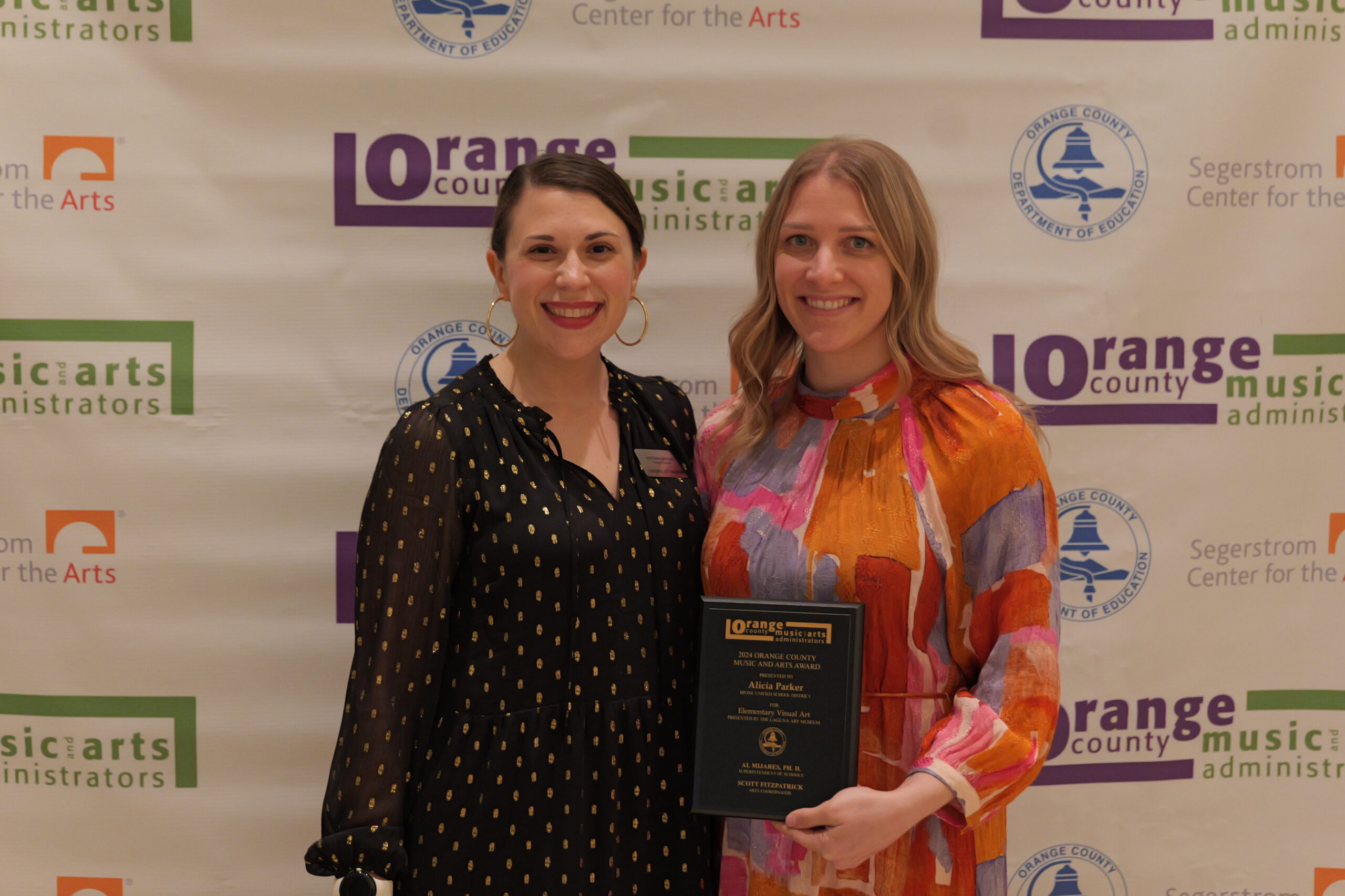 Alicia Parker, the 2024 OCMAA Award recipient for Elementary Visual Art from the Irvine Unified School District, is pictured with award presenter Victoria Gerard, deputy director of the Laguna Art Museum, during last year’s Orange County Music and Arts Administrators Awards Ceremony.