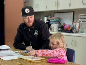 Teacher Ryan McAfee with student