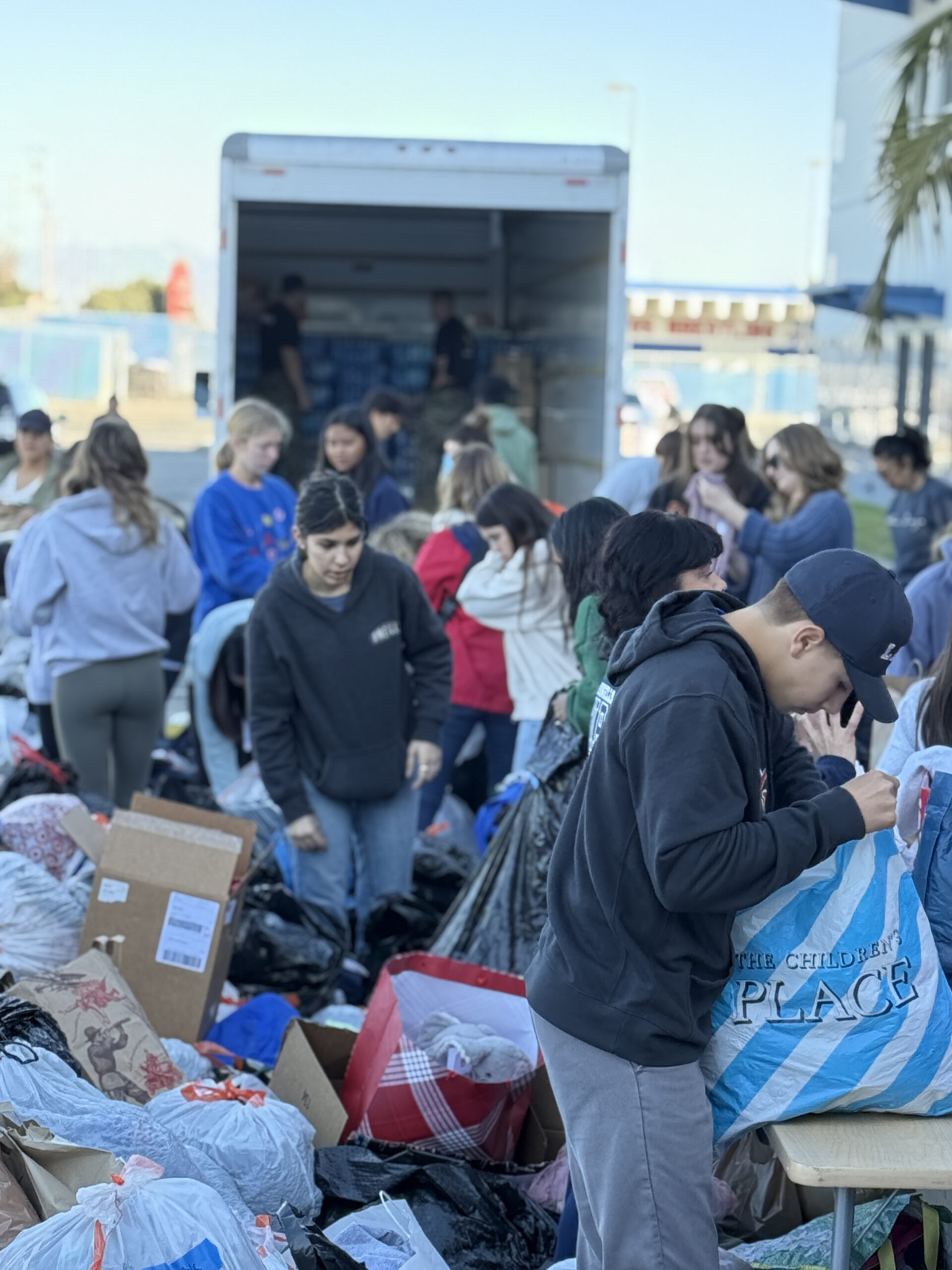 Los Alamitos High School students and staff organize donations for fire victims on Sunday, Jan. 12.